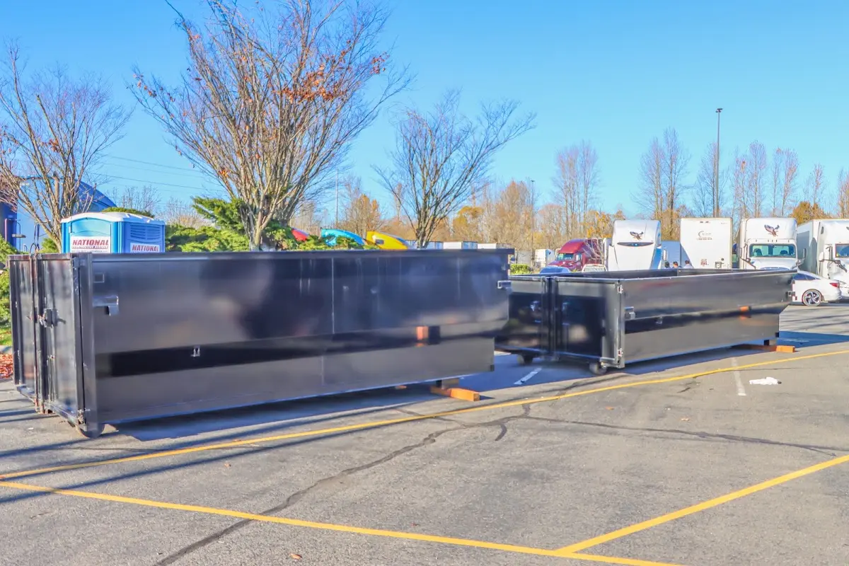 Professional dumpster rental service with roll-off container on residential driveway in Union Park